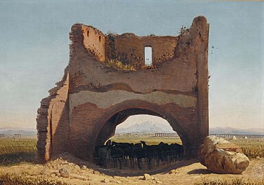 Chevaux à l'ombre d'une arche en ruine.