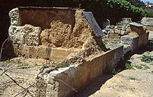 Remains of the mudbrick wall between two dining rooms of South Stoa I. Athens Agora South Stoa I mudbrick walls (1991).jpg