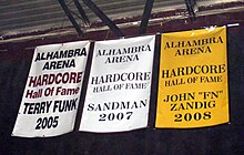 Sandman's Hardcore Hall of Fame banner in the former ECW Arena. Banners for Terry Funk, Sandman, and John 'FN' Zandig at the Hardcore Hall of Fame (2010).jpg