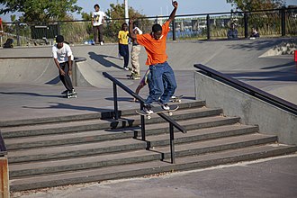 Boardslide at Far Rockaway Skatepark - 2019 Boardslide in an orange shirt at Far Rockaway Skatepark - 2019.jpg