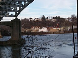 Belle Vernon, as seen from across the Monongahela River in a view showing the underside of the I-70 bridge looking east-north-east from Speers