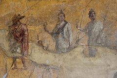 Anubis, Harpocrates, Isis and Serapis, antique fresco in Pompeii, Italy