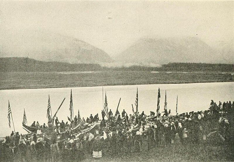 File:Chilkat Indians with flags and canoes (c. 1910).jpg
