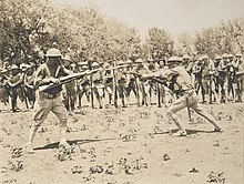 Doughboys of the 56th Infantry during bayonet practice at Camp MacArthur, Waco, Texas, July 17, 1918. Drills - Infantry - Bayonet - Bayonet practice, 56th Infantry, Camp MacArthur, Waco, Texas - NARA - 31475784 (cropped) (cropped).jpg