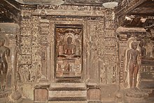 Mahavira with yaksha Matanga and yakshi Siddhaiki Ellora Caves 86.jpg