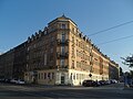 Apartment house in a corner and closed development