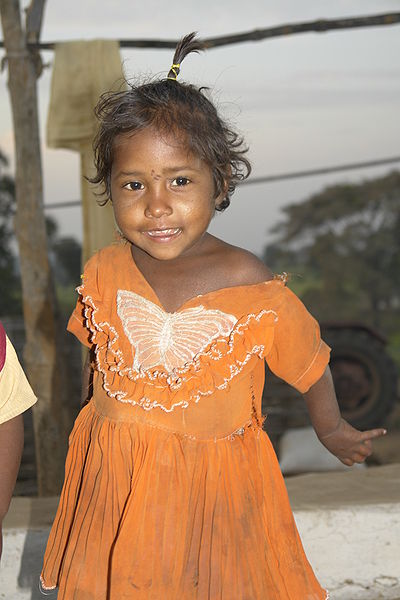 File:Girl in orange, Gauhadi village.jpg