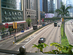 Bus lane on Gloucester Road in Hong Kong, with the words "bus lane" painted in English and "巴士綫" in Chinese