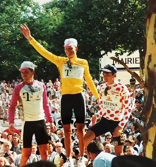 Bjarne Riis (centre) and Jan Ullrich (left) on the podium at the 1996 Tour de France