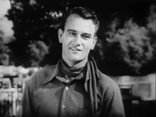 Wayne as "Singin' Sandy" Saunders in Riders of Destiny (1933) John Wayne in Riders of Destiny (1933) 02.png