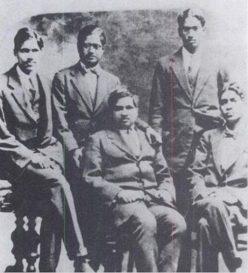 K Ananda Rau seated with Ramanujan