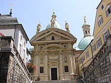 Façade of St. Catherine of Alexandria's Church with dome of attached Mausoleum of Emperor Ferdinand II to the right