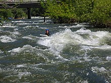 A riverboarder floats down the Kern River at about 110 m /s (4,000 cu ft/s). KernRiverboarding01.jpg