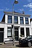 Huis met gepleisterde lijstgevel