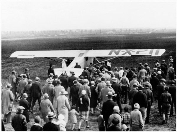 Nearly a thousand people assembled at Roosevelt Field to see Charles Lindbergh take off in the Spirit of St. Louis, May 20, 1927