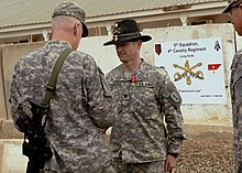 Richardson (right) is presented with the Bronze Star with 'V' device for valor by Major General Daniel Bolger on March 1, 2009 at Camp Liberty. Longknife commander, Non-commissioned officer recognized for valor DVIDS154234.jpg