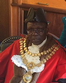 Martin Moyo in his ceremonial regalia at the Mayoral parlor in 2015.jpg