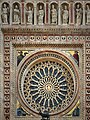 Rose window with the Four Doctors of the Church and 52 heads of saints around it