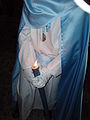 Penitente y su vela de cerca.  Domingo de Ramos. Semana Santa en El Puerto de Santa María, Cádiz, España.