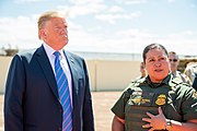 President Trump with a U.S. Customs and Border Protection officer President Trump Visits Calexico, CA (46840362274).jpg