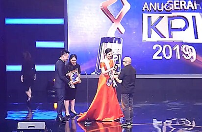 Sonia (women in orange gown) as a presenter of The Indonesian Broadcasting Commission of The Republic of Indonesia event - "Anugerah KPI 2019" on 9 December 2019.