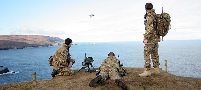 RAF Regiment Forward Air Controllers from the Air Land Integration Cell, based at RAF Coningsby, guide a Typhoon from 6 Squadron onto their target at the Cape Wrath practice range in Scotland.