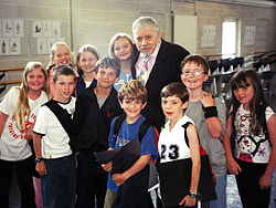 Original London Cast Janes & Michaels, Left to right (FRONT): Poppy Lee Friar, Jack Montgomery, Perry Millward, Harry Stott, Ben Watton, Jake Catterall, Nicola Bowman. Left to right (BACK): Charlotte Spencer, Faye Spittlehouse, Carrie Fletcher, with songwriter Robert B. Sherman. (Photo Date: 19 July 2004)