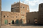 Mudbrick house with decorated windows