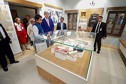 Clothing worn by Mujib and his family members during their assassination, are preserved in the glass box Secretary Kerry is Looking at Evidence From a Trial for an Attack in Dhaka (28692594183).jpg