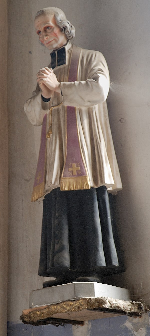Statue of Jean-Marie Vianney in the church of a small village in France