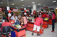 Seated cashiers at a supermarket in Seychelles, February 2020. Seychelles supermarket.jpg