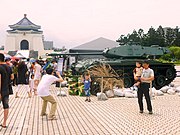 Display of armored tank near memorial