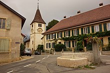 A road with a church in Bôle, Switzerland