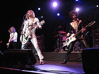 The Darkness topped the chart for three weeks in 2004 with Permission to Land, their debut studio album. TheDarkness2012.jpg