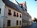 Residential house with courtyard buildings in semi-open development