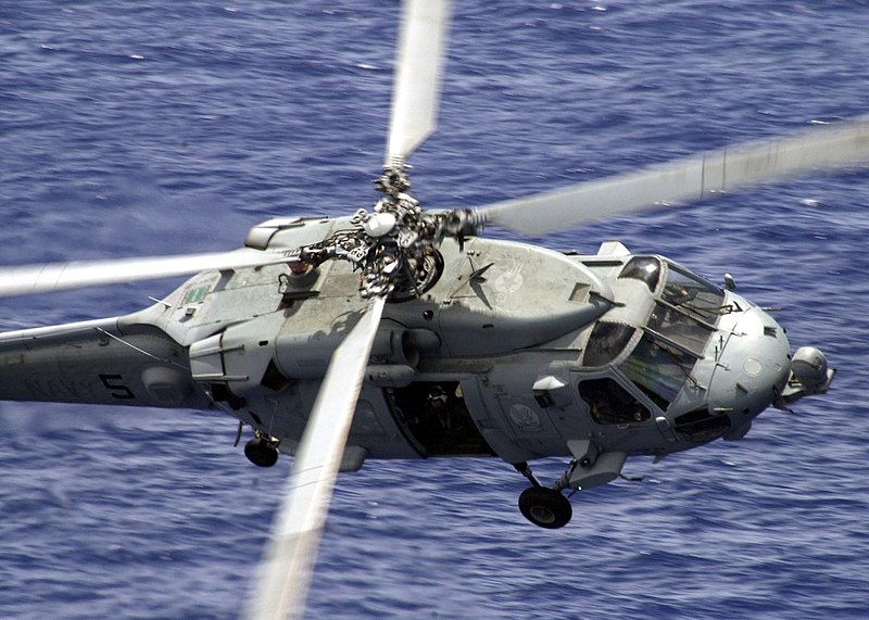 File:US Navy 030513-N-0295M-012 Seahawk banks sharply towards the Constellation to demonstrate it's ability to quickly decelerate.jpg