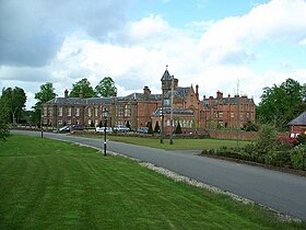 Vale Royal Abbey as it is today. The Tudor and later mansion is built around the core of the mediaeval south and west ranges of the former cloister and contains surviving rooms including the abbot's great hall. Vale royal abbey.jpg