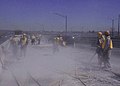 Workers clearing dust from highway (9248567530).jpg