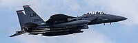 An F-15E Strike Eagle, tail number 01-2003, taking off from RAF Lakenheath in England. The aircraft is assigned to the 494th Fighter Squadron.