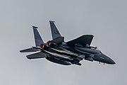 An F-15E Strike Eagle, tail number 97-0218, taking off from RAF Lakenheath in England. The aircraft is assigned to the 492nd Fighter Squadron.