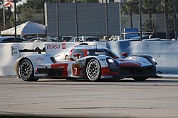 The #7 Toyota GR010 Hybrid on the front straight at sunset while leading the 1000 Miles of Sebring. 2023Sebring1000milesToyotaGR010 (cropped).jpg