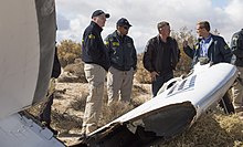 NTSB staff talk with Virgin Galactic pilot Todd Ericson Acting Chairman Hart w Virgin Galactic pilot Todd Ericson & investigators at SpaceShipTwo accident site (15705681362).jpg