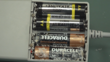 Potassium compound leakage inside an alkaline battery Alkaline Battery Leakage Inside a Product.png