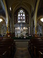 The Gothic Revival-style altar of Saint Patrick Church. Located at 284 Suffolk Street, Lowell, Massachusetts.