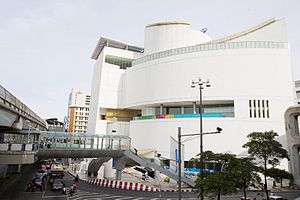 A modern-looking building with a smooth curved exterior on the corner of a road junction