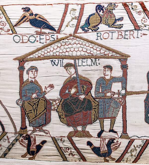 Robert (Rotbert), Count of Mortain (right) sits at the left hand of his half-brother William, Duke of Normandy. Robert's full brother Odo (Odo Ep[isco