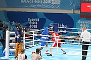 Deutsch: Boxen bei den Olympischen Jugendspielen 2018 Tag 12, 18. Oktober 2018 - Kampf um die Bronzemedaille im Fliegengewicht Mädchen – Timur Merjanow (Usbekistan, rot) schlägt Youssef Ali Karar Ali (Ägypten, blau) 5-0; Ringrichter ist Antonín Gaspar (Tschechien). English: Boxing at the 2018 Summer Youth Olympics on 18 October 2018 – Boy's heavyweight Bronze Medal Bout - Timur Merjanov (Uzbekistan, red) beats Youssef Ali Karar Ali (Egypt, blue) 5-0; Referee is Antonín Gaspar (Czech Republic). Español: Boxeo en los Juegos Olímpicos Juveniles de Verano de 2018 en 18 de octubre de 2018 - Medalla de bronce de peso pesado del muchacho: Timur Merjanov (Uzbekistán, roja) le gana a Youssef Ali Karar Ali (Egipto, azul) 5-0; El árbitro es Antonín Gaspar (Republica checa).