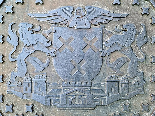 Close-up of the coat of arms of Breda on a manhole cover