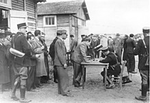 Arrestees registered upon arrival at Pithiviers camp by French gendarmes Bundesarchiv Bild 183-S69238, Frankreich, Internierungslager Pithiviers.jpg