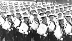 Trettioårsdagen av DDR:s grundande firas med en militärparad. Officersaspiranter från Nationale Volksmarines officershögskola Karl Liebknecht under förbimarsch.